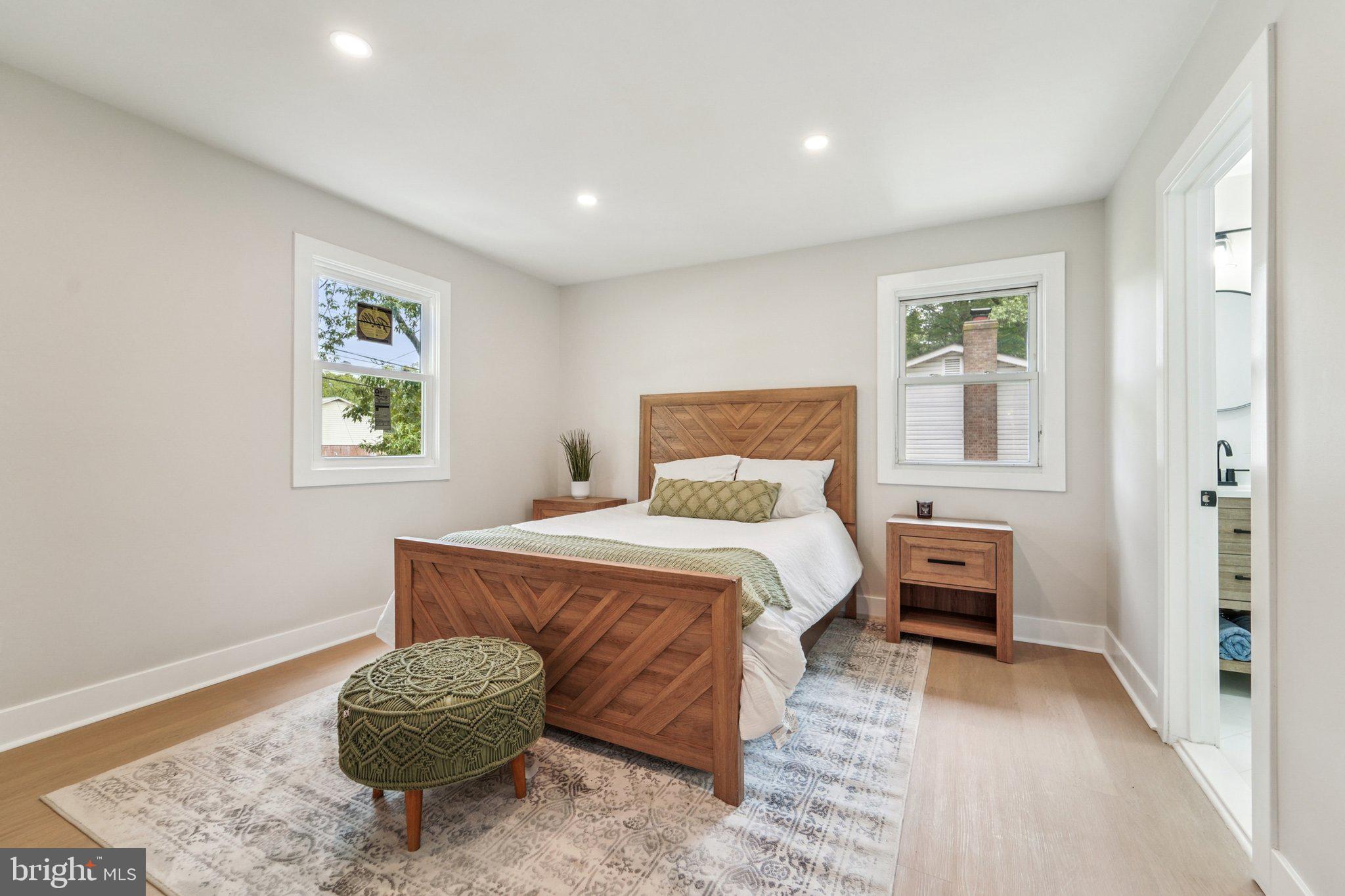 9168 Fort Smallwood Road Pasadena, MD 21122 - Photo 7 of 42 a bedroom with a bed and a painting on the wall