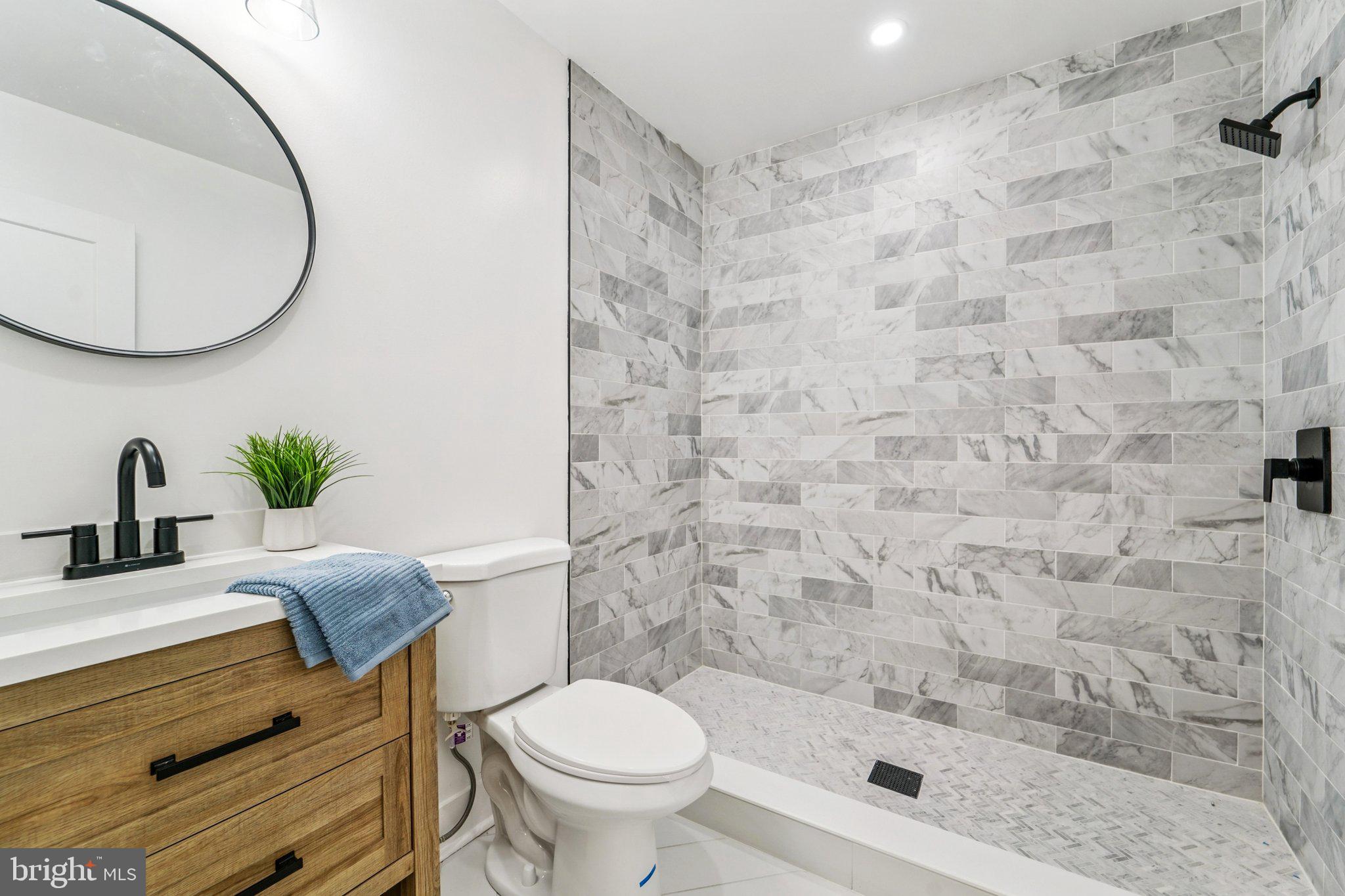 9168 Fort Smallwood Road Pasadena, MD 21122 - Photo 9 of 42 a bathroom with a sink and a mirror