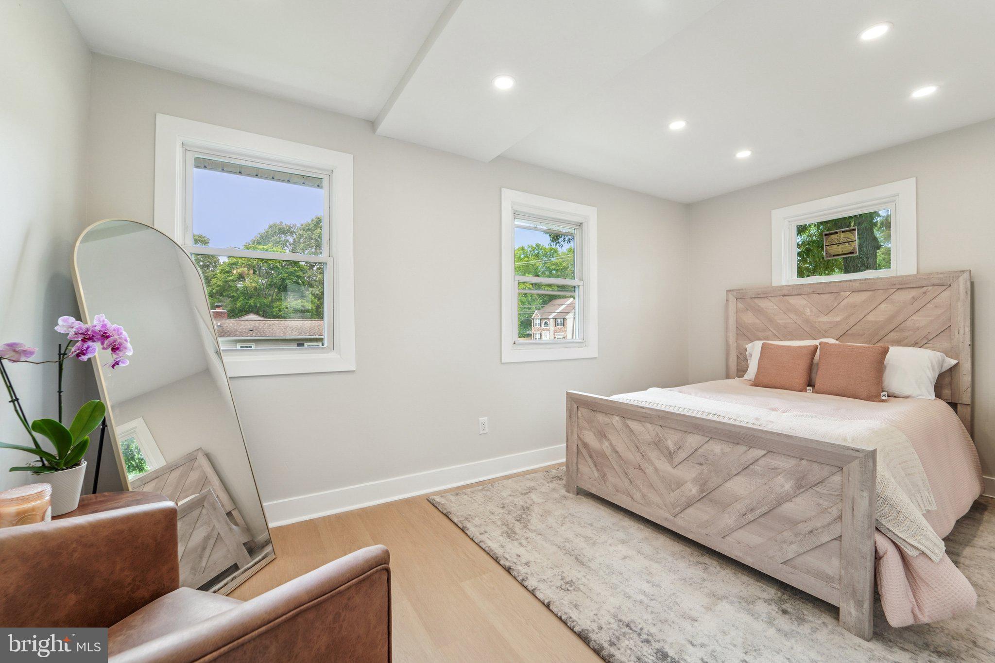 9168 Fort Smallwood Road Pasadena, MD 21122 - Photo 10 of 42 a bedroom with a bed and a couch