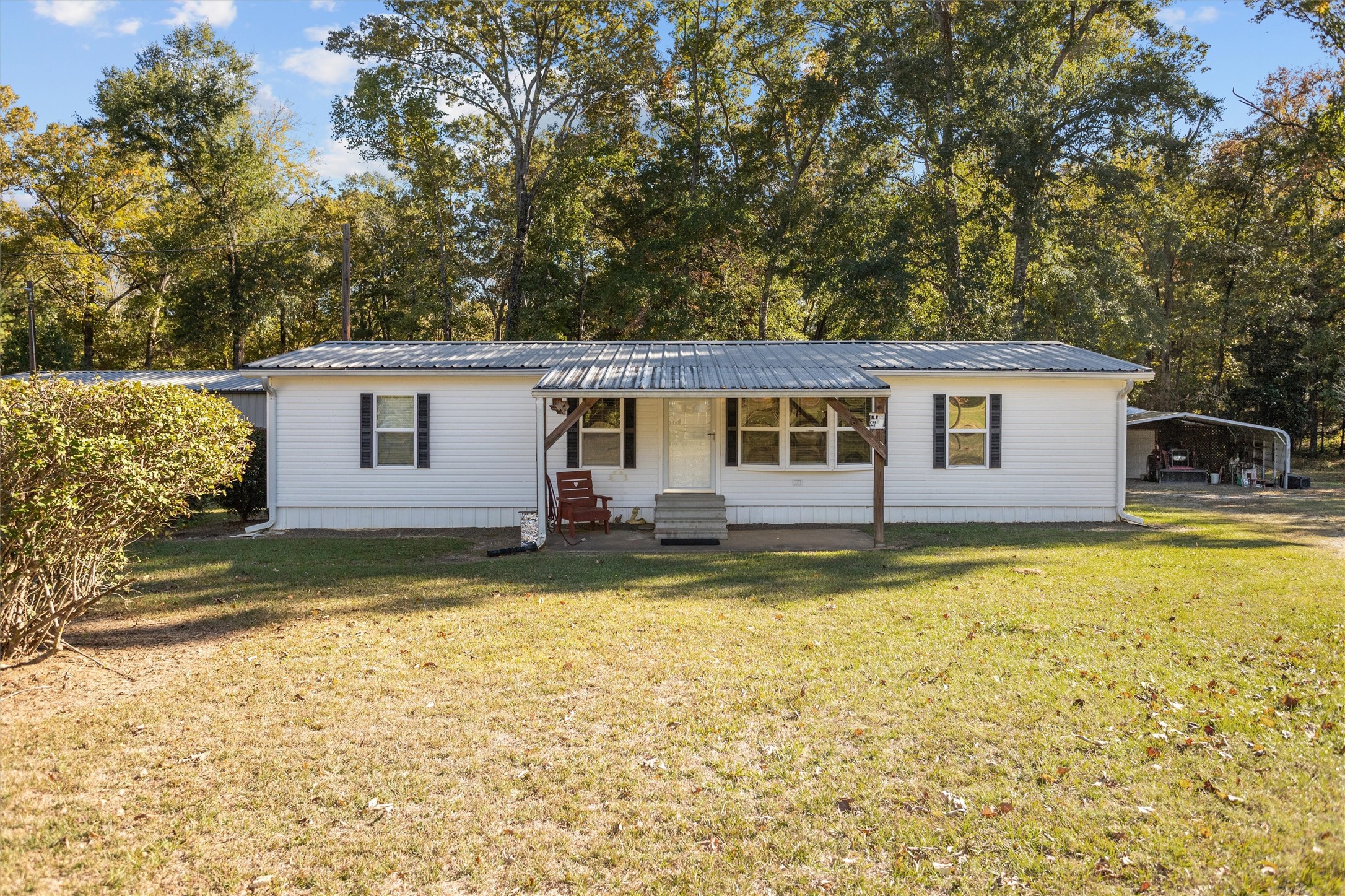 2330 Sabinetown Road Hemphill, TX 75948 - Photo 2 of 34 a view of a house with swimming pool and a yard