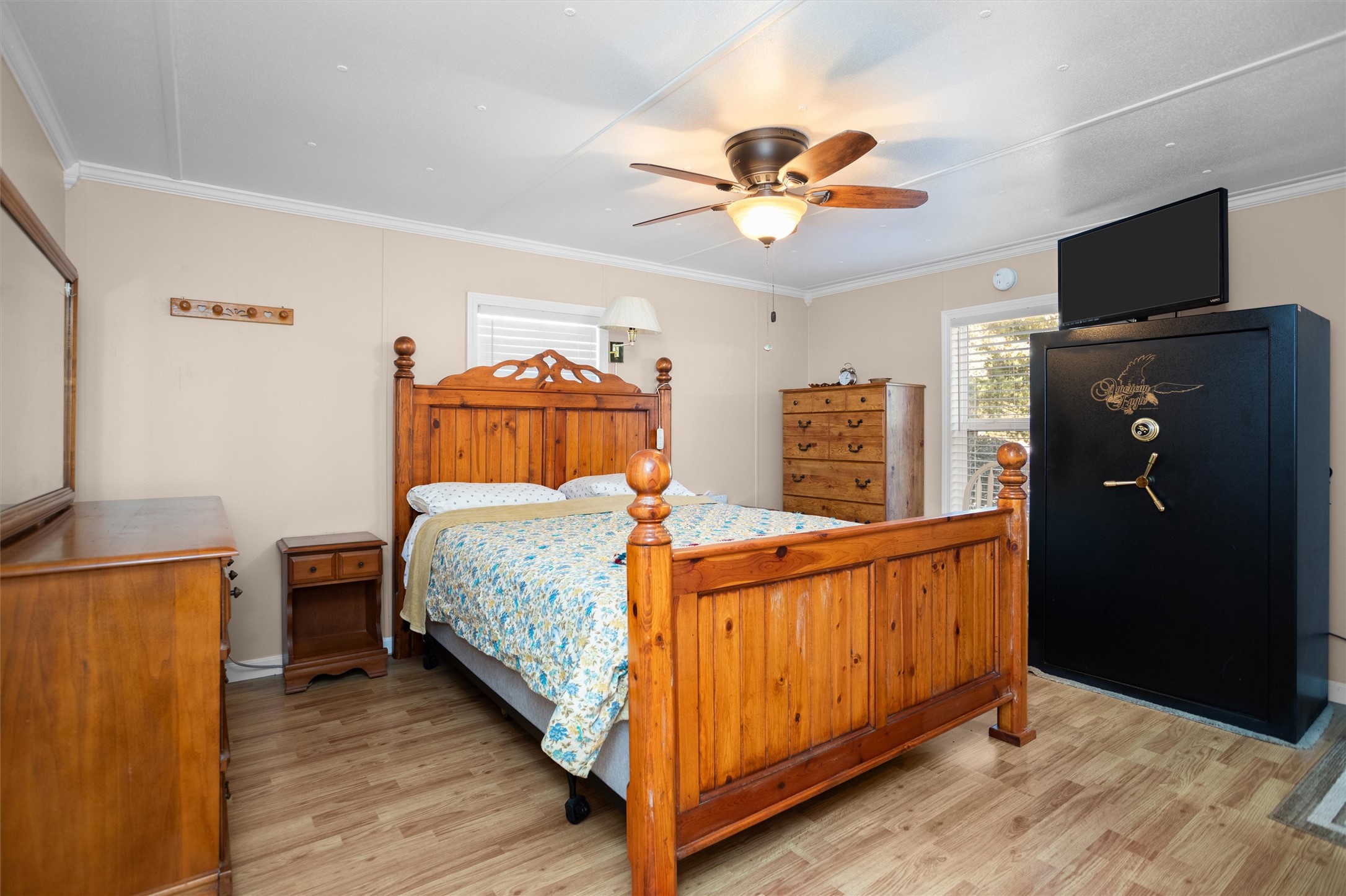 2330 Sabinetown Road Hemphill, TX 75948 - Photo 23 of 34 a bedroom with a bed and a flat tv screen on a dresser
