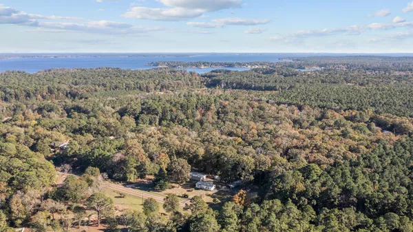 a view of a yard with wooden floor