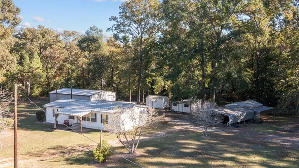 a view of a field with mountains in the background