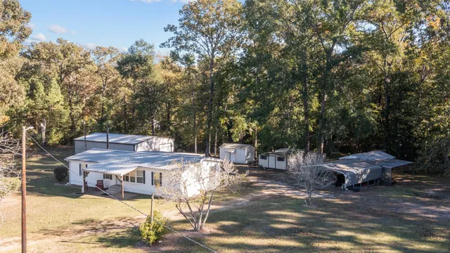 a view of a field with mountains in the background