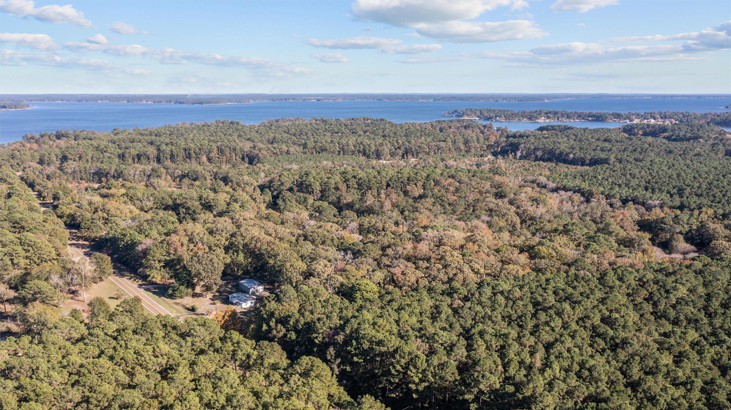 2330 Sabinetown Road Hemphill, TX 75948 - Photo 32 of 34 a view of a field with mountains in the background