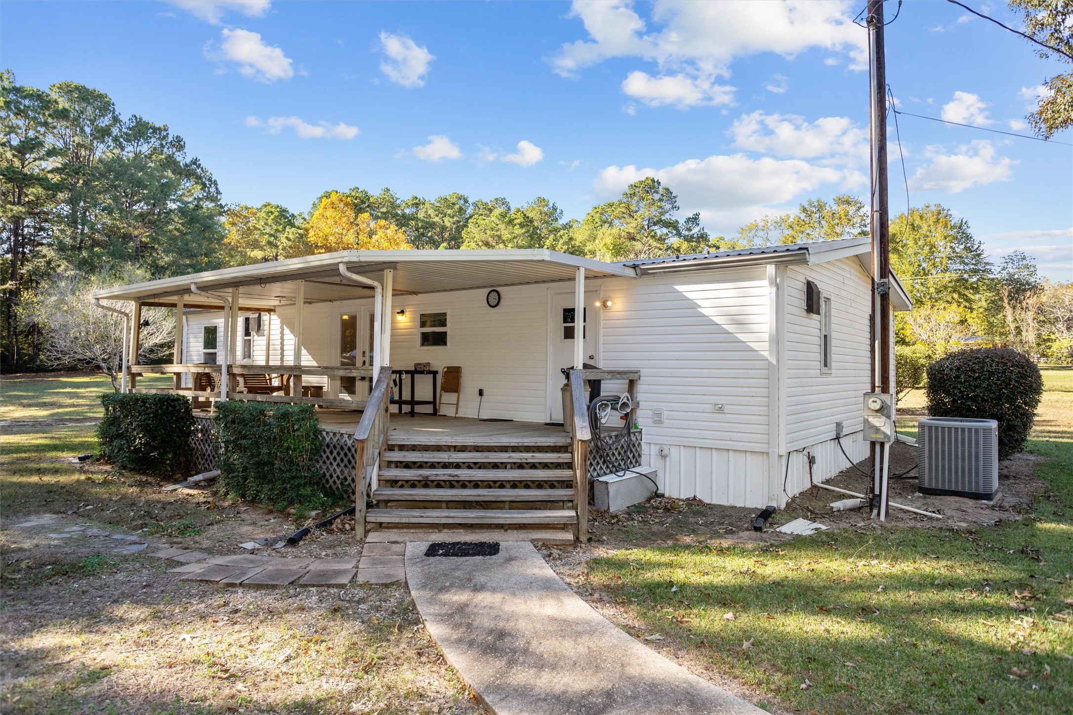 2330 Sabinetown Road Hemphill, TX 75948 - Photo 5 of 34 a view of a house with backyard and sitting area