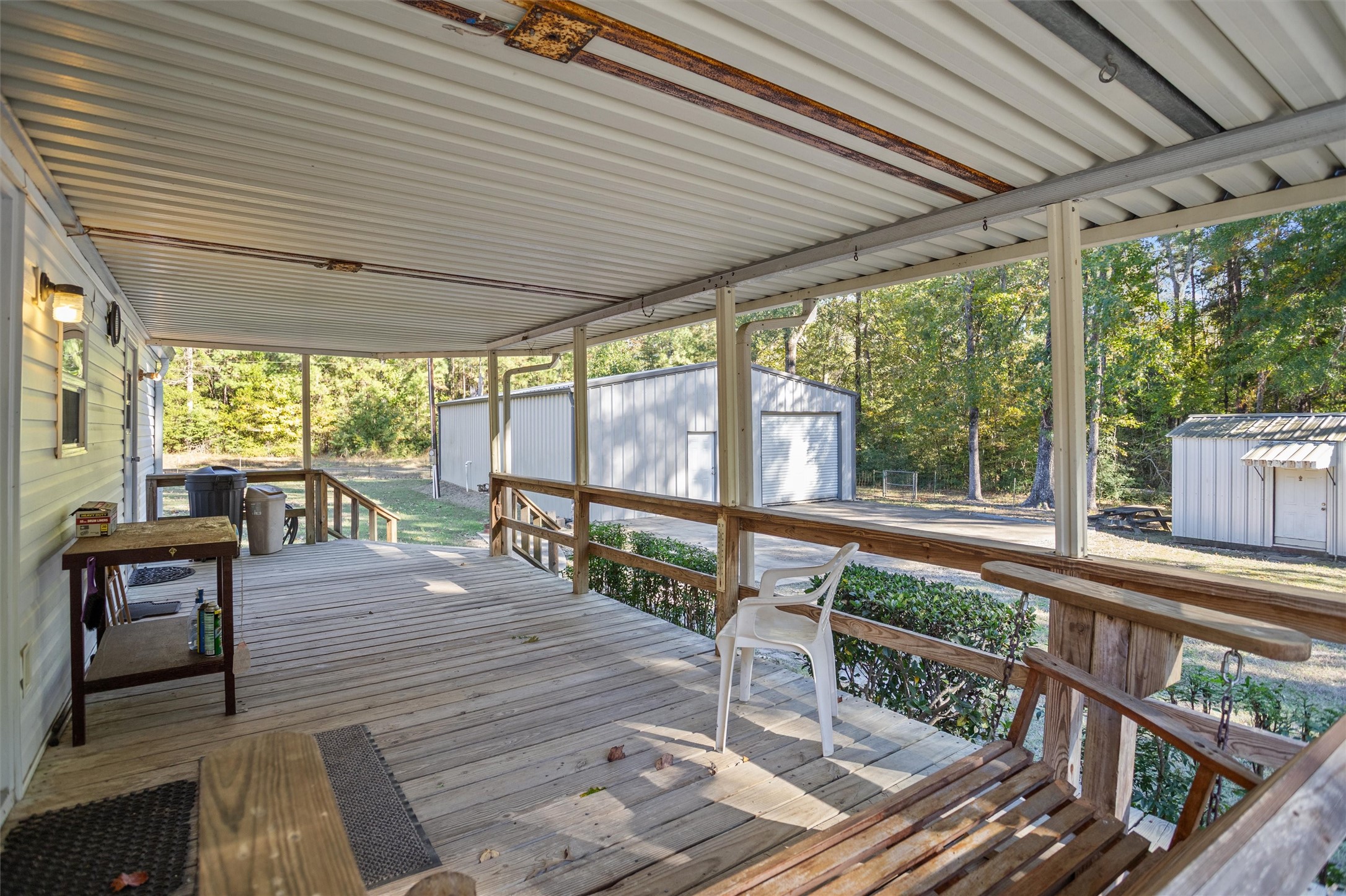2330 Sabinetown Road Hemphill, TX 75948 - Photo 6 of 34 a balcony with furniture and wooden floor