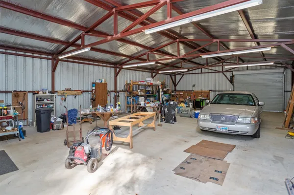 a view of parking garage with cars
