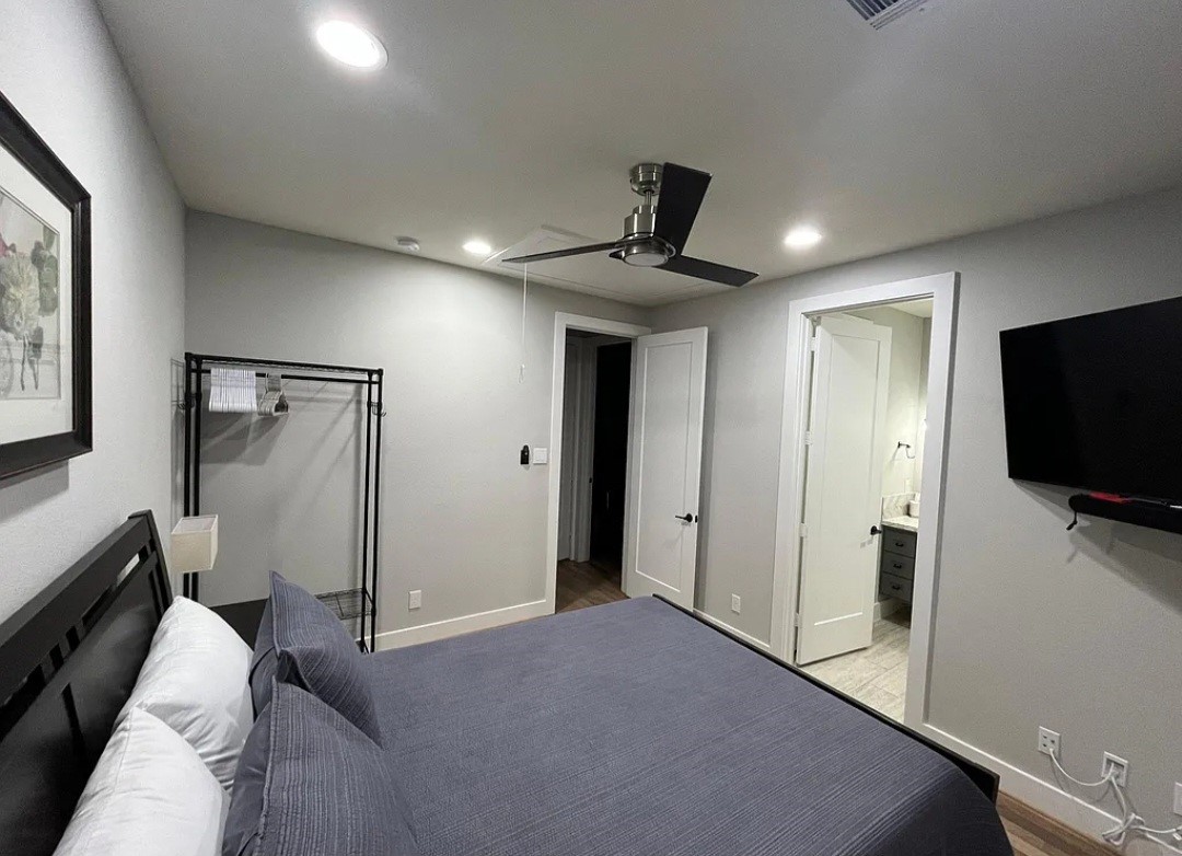 1503 Robin Street, Unit C Houston, TX 77019 - Photo 12 of 18 a living room with furniture and a flat screen tv