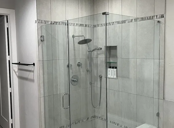 a bathroom with a shower and a shower