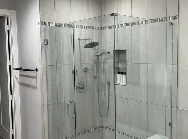 a bathroom with a shower and a shower