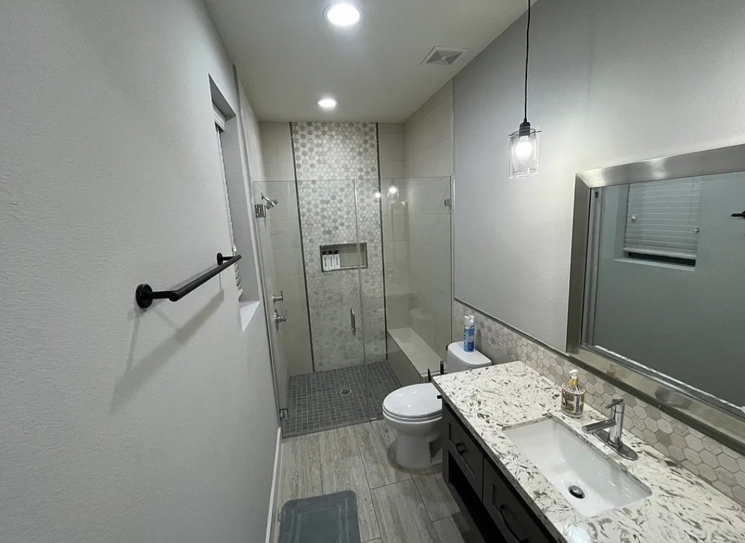1503 Robin Street, Unit C Houston, TX 77019 - Photo 14 of 18 a bathroom with a sink a toilet and shower