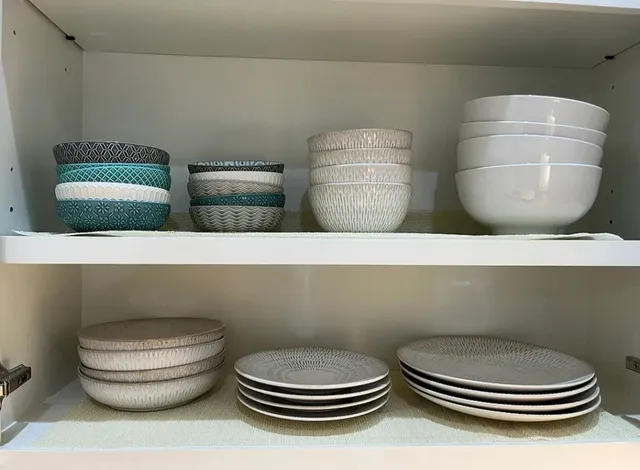 a bathroom with a toilet and a mirror