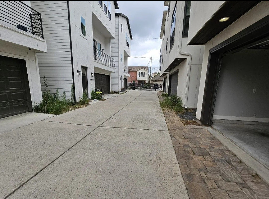 1503 Robin Street, Unit C Houston, TX 77019 - Photo 2 of 18 a view of a street with buildings