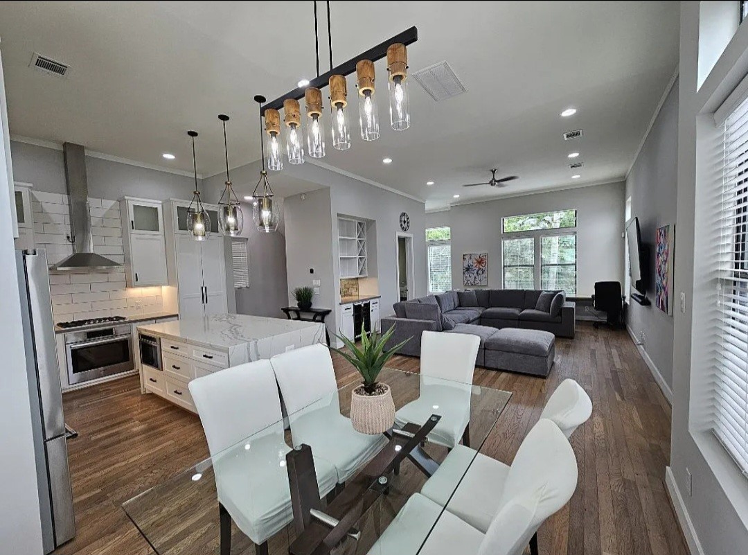 1503 Robin Street, Unit C Houston, TX 77019 - Photo 5 of 18 a living room with furniture kitchen view and a chandelier