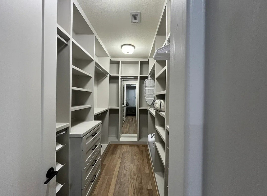 1503 Robin Street, Unit C Houston, TX 77019 - Photo 8 of 18 a view of walk in closet with empty racks