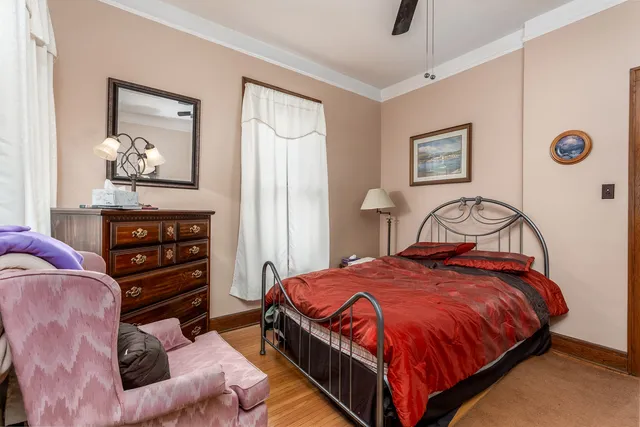 a view of a closet with wooden floor