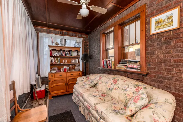 a bedroom with a bed and a fireplace