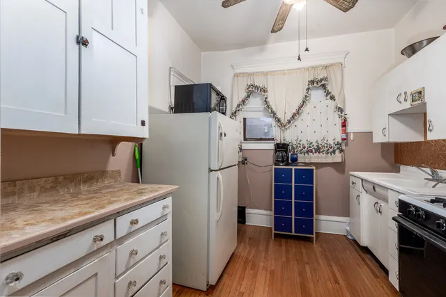 a bedroom with a bed and a mirror