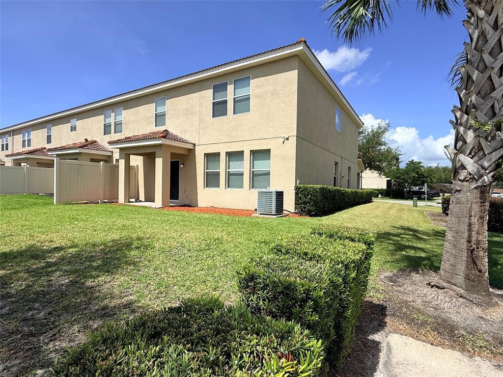 2084 Water Tupelo Way Ocoee, FL 34761 - Photo 24 of 34 a front view of a house with a yard