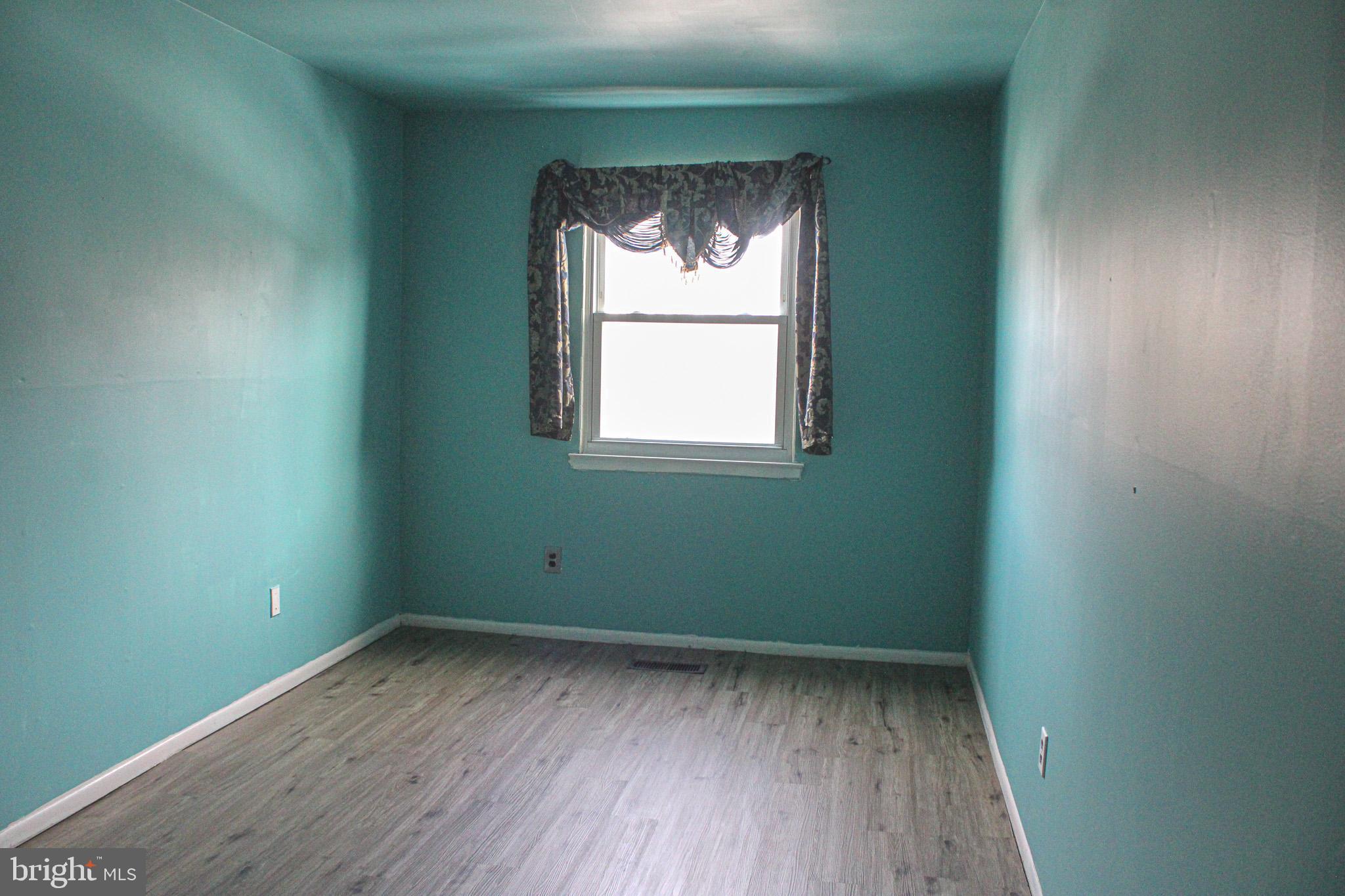 3224 Comly Road Philadelphia, PA 19154 - Photo 21 of 32 an empty room with a window and wooden floor