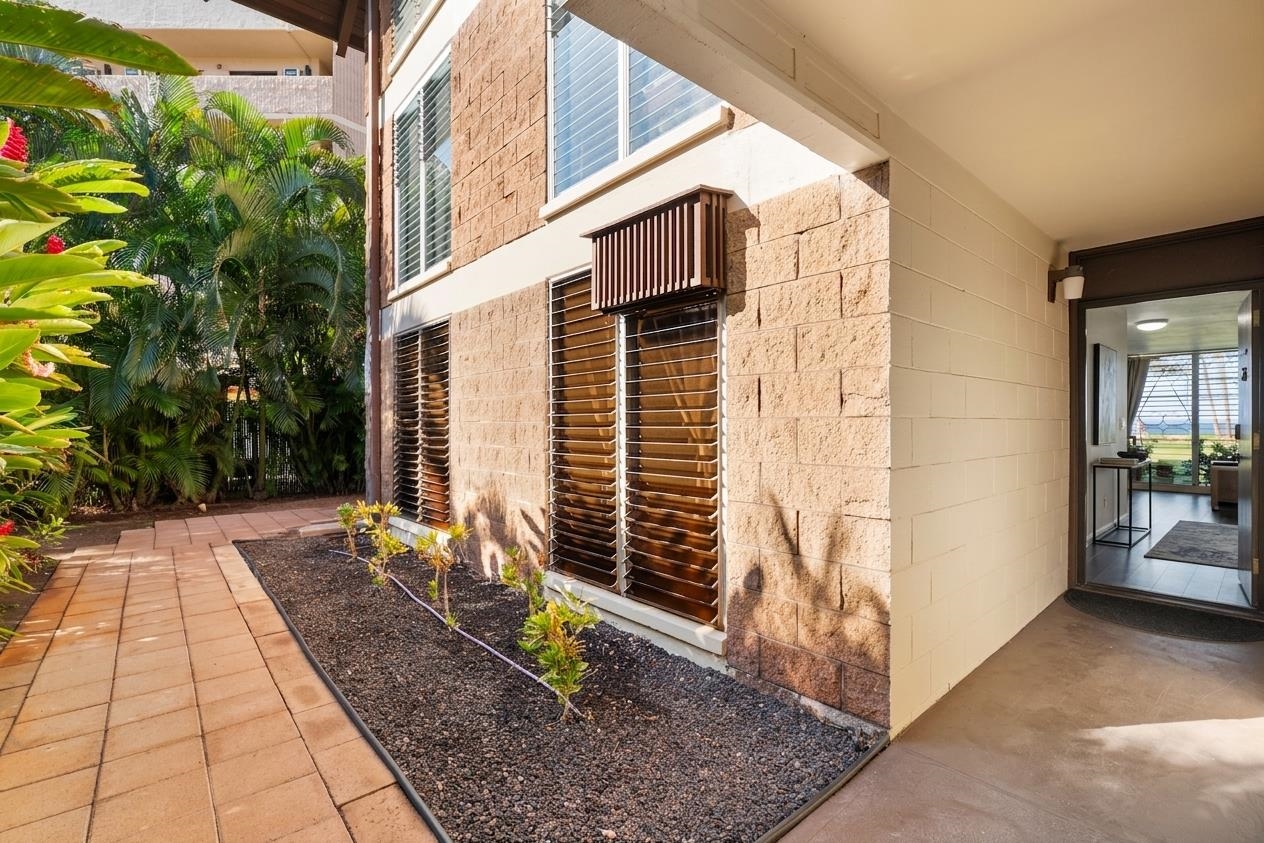 1002 South Kihei Road, Unit 114 Kihei, HI 96753 - Photo 48 of 50 a view of a house with backyard