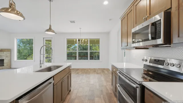 a view of a kitchen and a sink