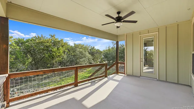 a view of a house with backyard and a tree