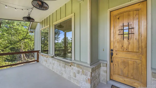 a view of an empty room with a fireplace and a window