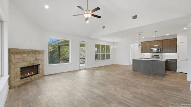 a view of kitchen with white cabinets and sink