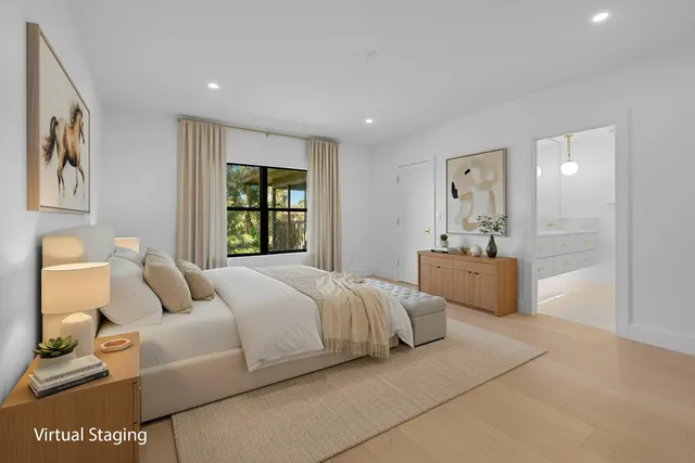 a bedroom with bed and window