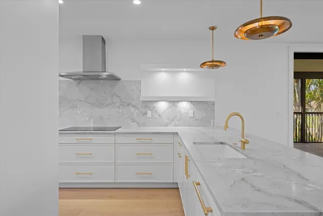 a kitchen with a sink and cabinets