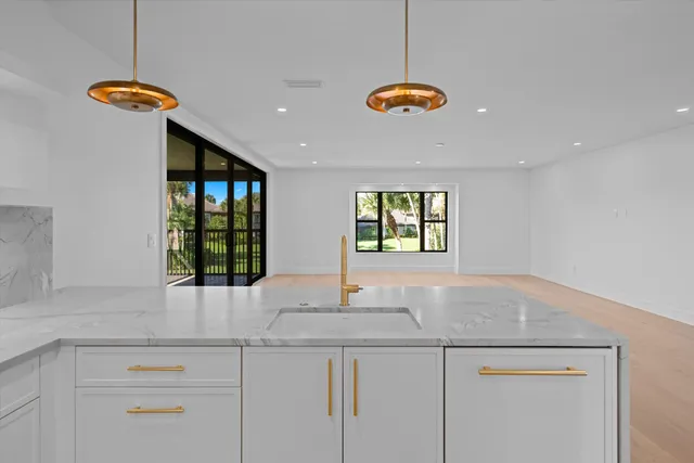 a bathroom with a sink and a window