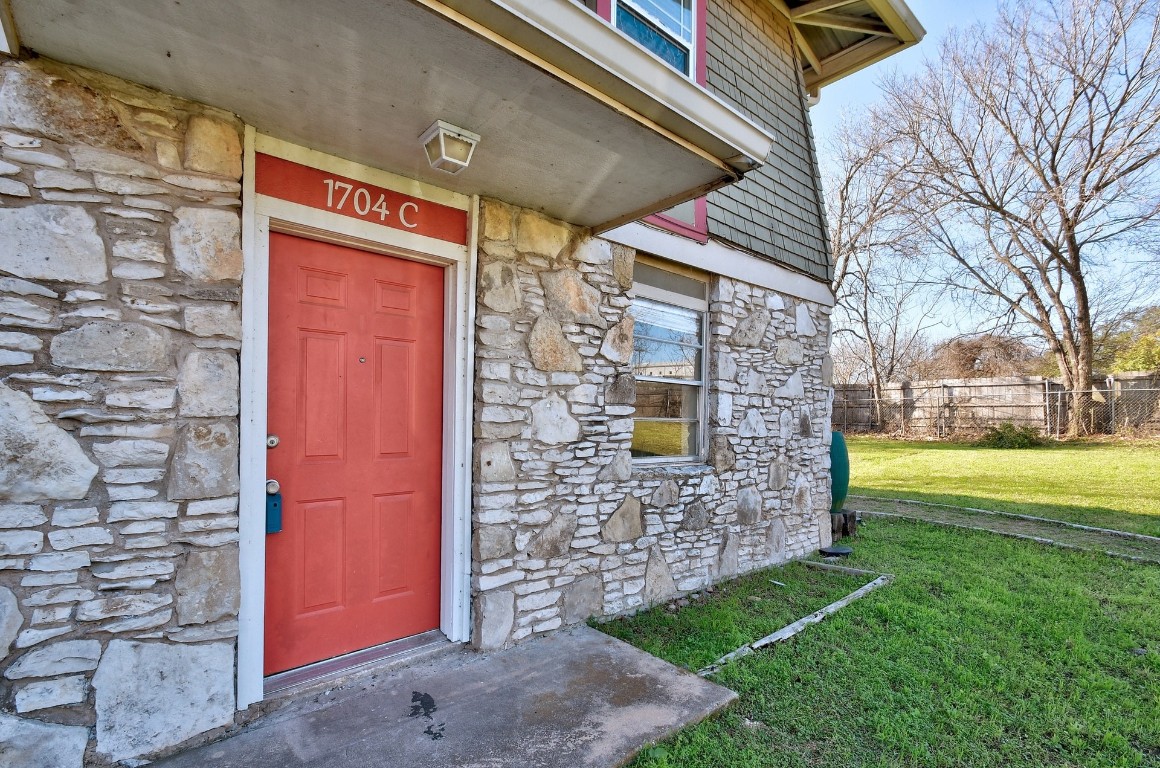 1704 East M. Franklin Avenue, Unit C Austin, TX 78721 - Photo 1 of 18 a view of a brick house with a large window