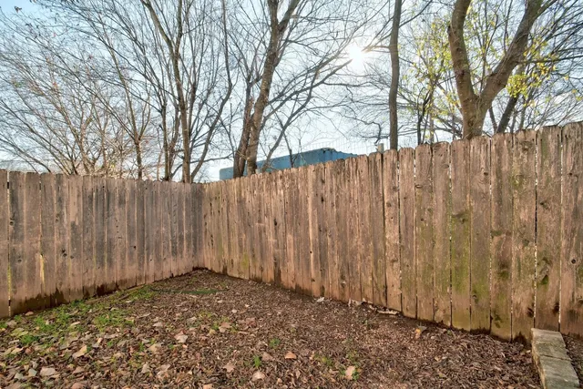 a view of a backyard of the house