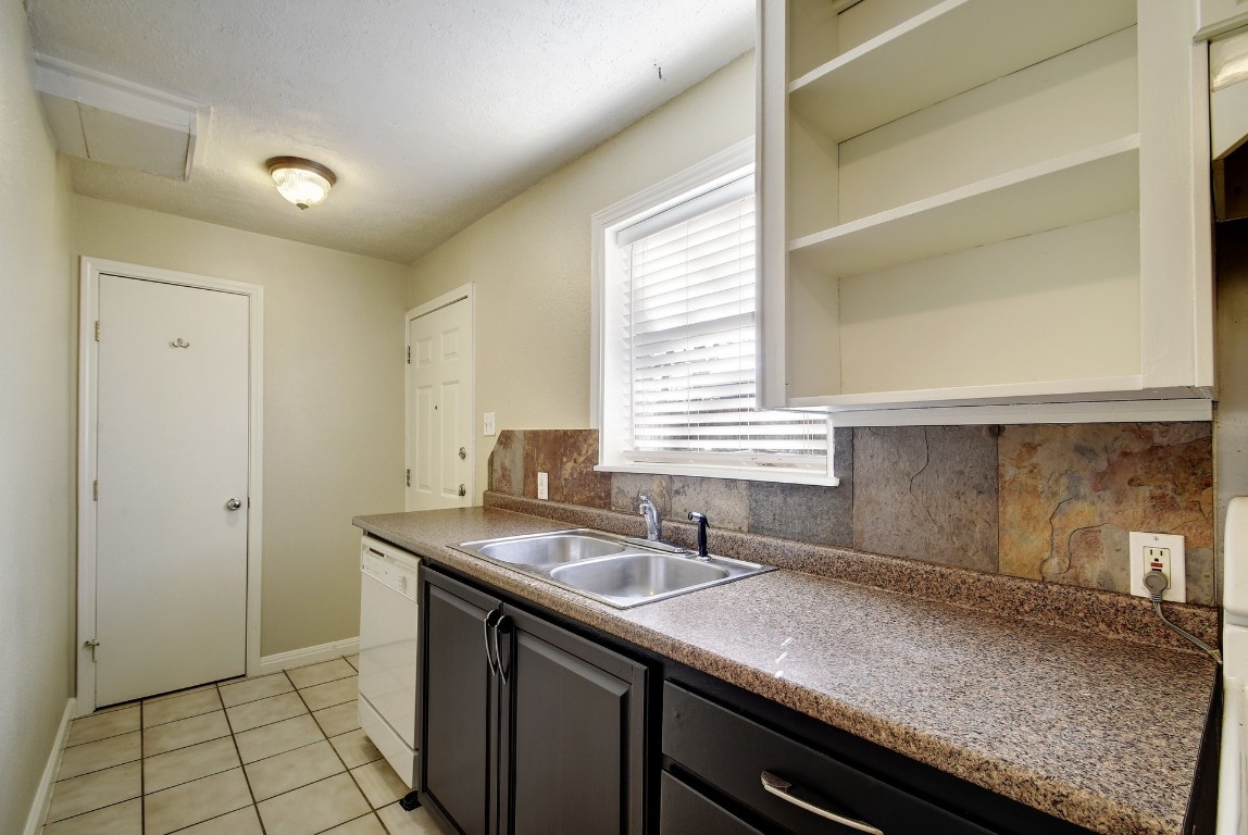 1704 East M. Franklin Avenue, Unit C Austin, TX 78721 - Photo 7 of 18 a kitchen with a sink and a window