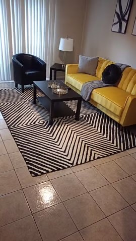 a living room with a couch and a coffee table