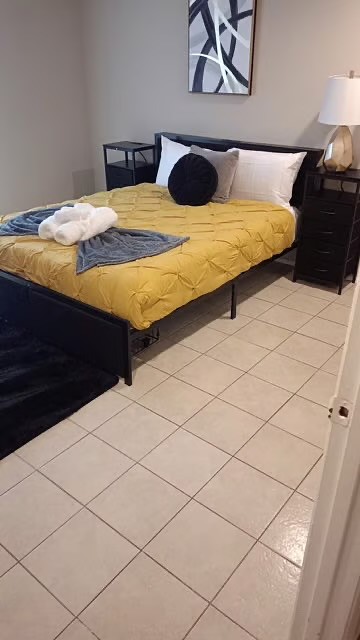 3300 Pebblebrook Drive, Unit 75 Seabrook, TX 77586 - Photo 3 of 30 a bedroom with a bed and painting on the wall