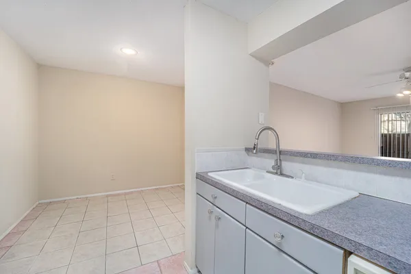 a bathroom with a sink and vanity