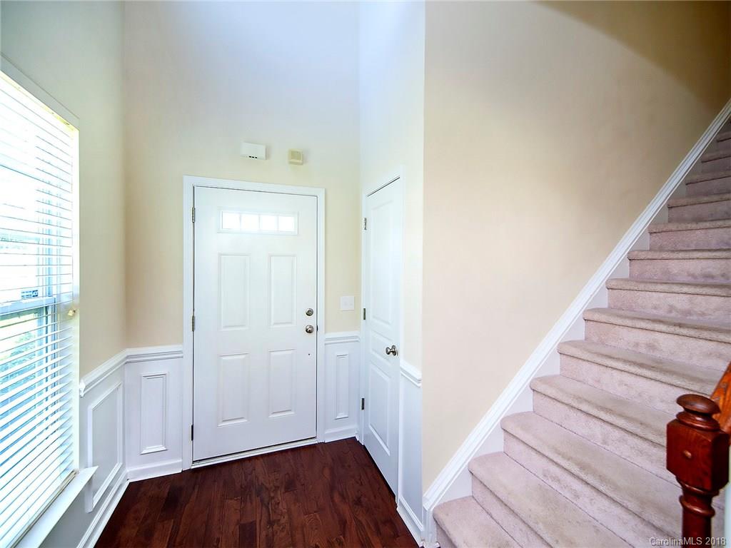 284 Sand Paver Way Fort Mill, SC 29708 - Photo 3 of 24 a view of a hallway with wooden floor and entryway