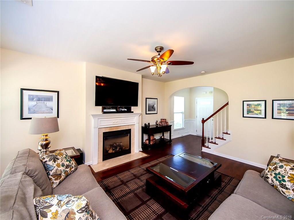 284 Sand Paver Way Fort Mill, SC 29708 - Photo 5 of 24 a living room with furniture flat screen tv and a fireplace
