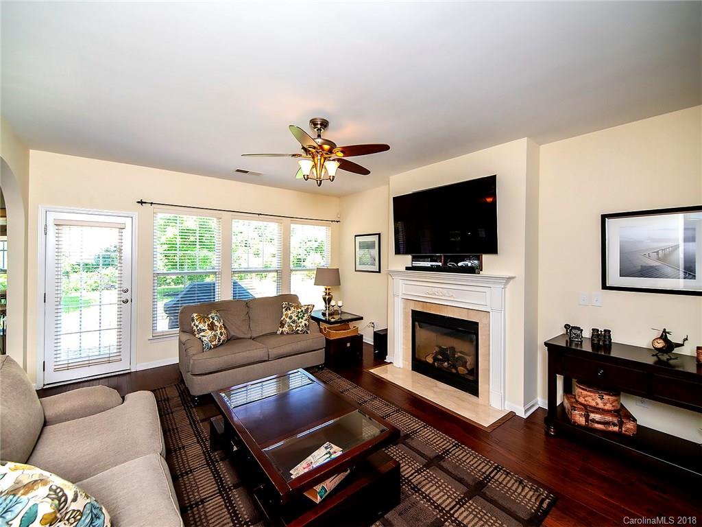 284 Sand Paver Way Fort Mill, SC 29708 - Photo 6 of 24 a living room with furniture fireplace and flat screen tv