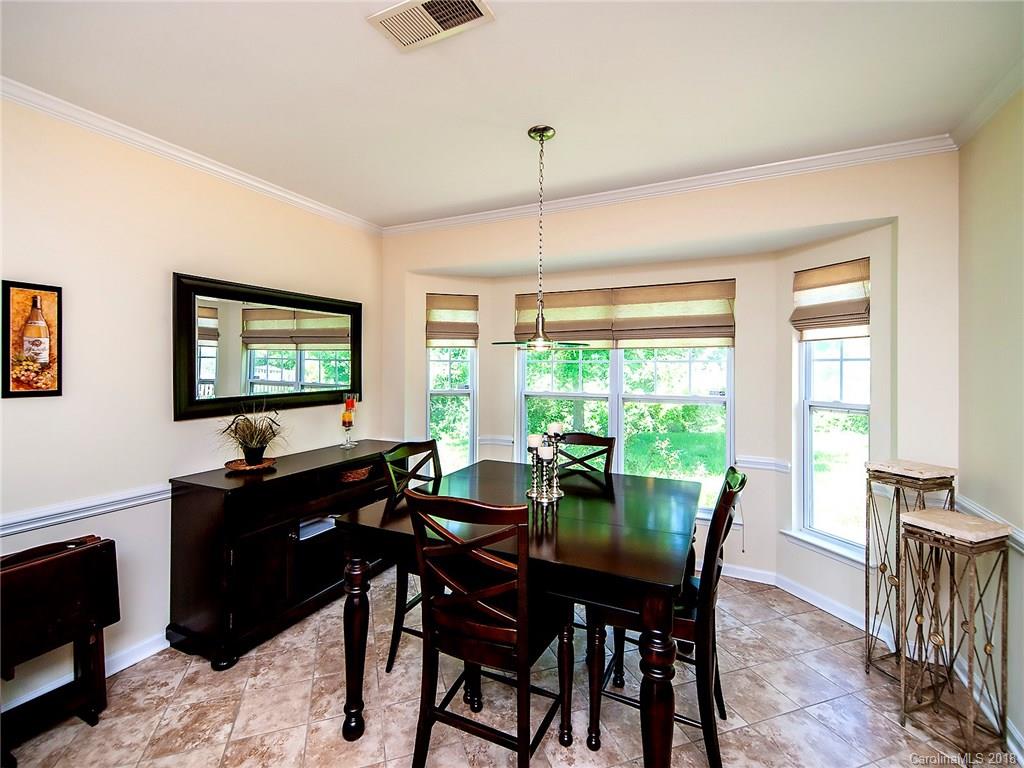 284 Sand Paver Way Fort Mill, SC 29708 - Photo 7 of 24 a view of a dining room with furniture window and outside view