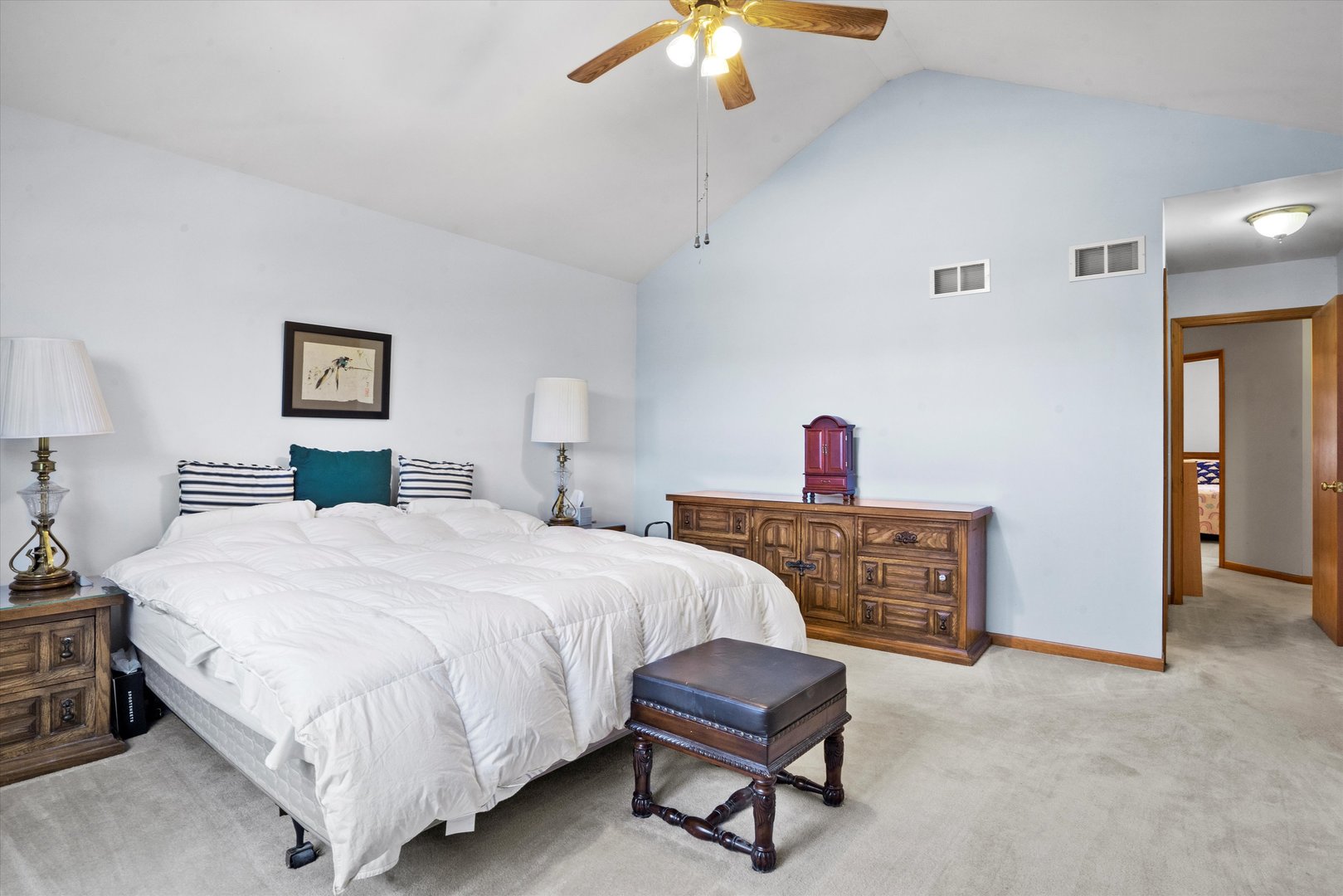 2260 Manchester Road Wheaton, IL 60187 - Photo 16 of 35 a bedroom with a bed and a chandelier