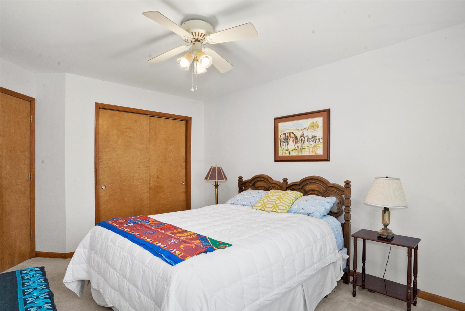 2260 Manchester Road Wheaton, IL 60187 - Photo 19 of 35 a bedroom with a bed and a chandelier