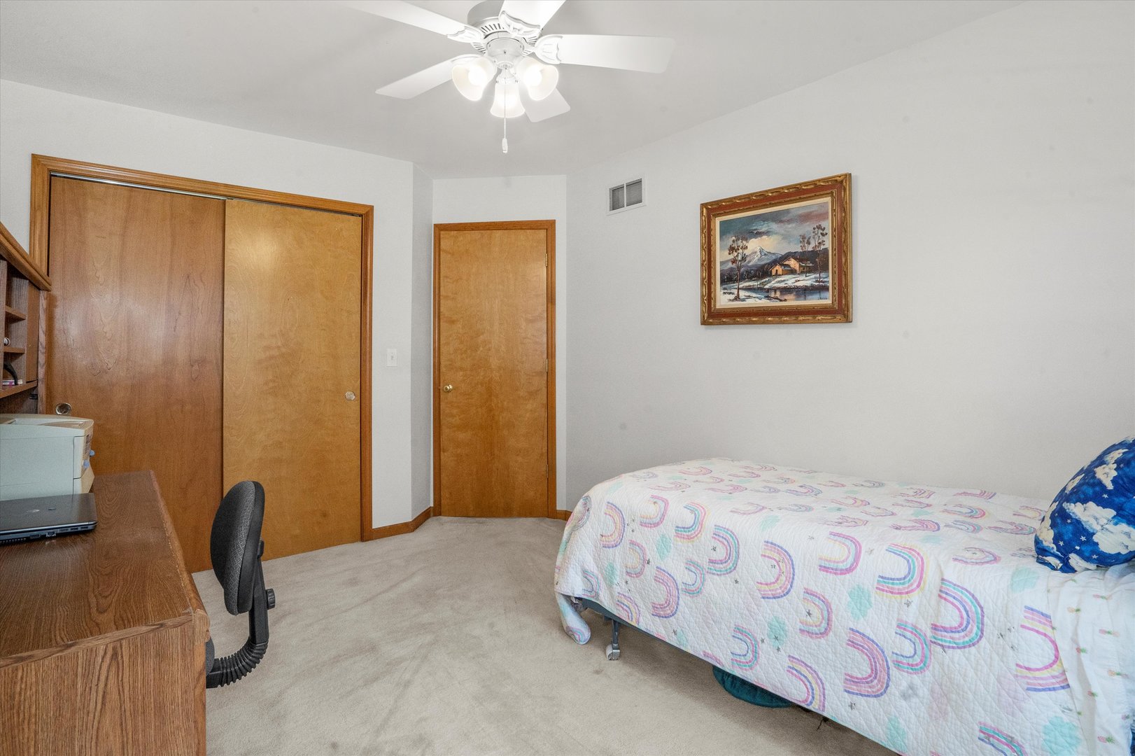 2260 Manchester Road Wheaton, IL 60187 - Photo 22 of 35 a bedroom with a bed and a chandelier