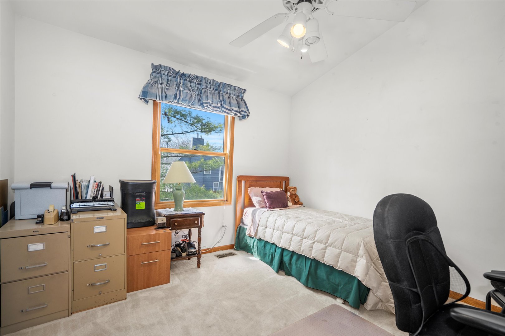 2260 Manchester Road Wheaton, IL 60187 - Photo 23 of 35 a room with a bed and a chandelier