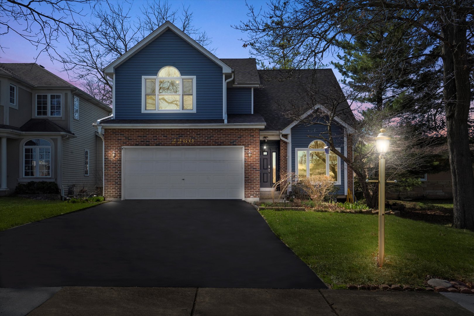 2260 Manchester Road Wheaton, IL 60187 - Photo 34 of 35 a front view of a house with a yard