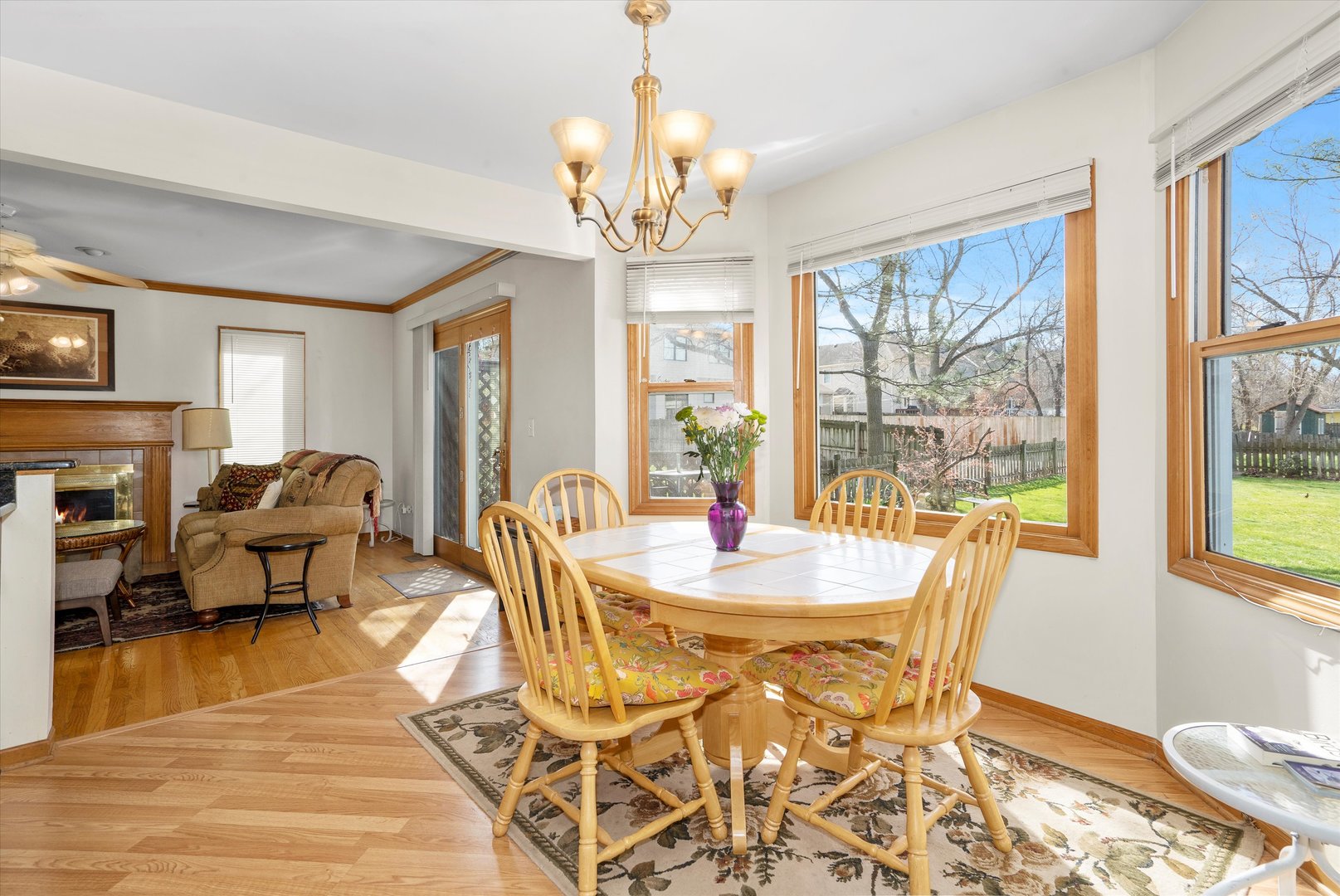 2260 Manchester Road Wheaton, IL 60187 - Photo 7 of 35 a view of a dining room with furniture a chandelier and wooden floor