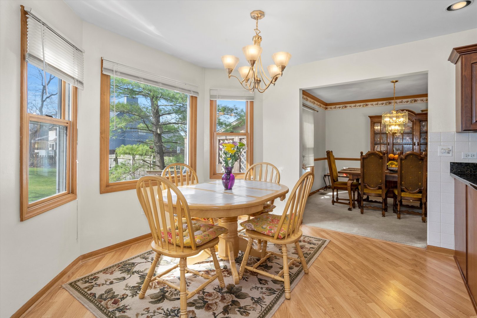 2260 Manchester Road Wheaton, IL 60187 - Photo 8 of 35 a view of a dining room with furniture window and outside view
